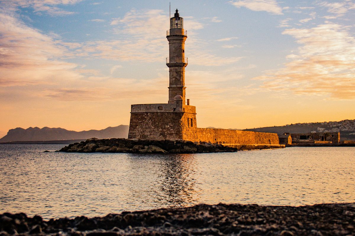 The Venetian lighthouse at the entrance to Chania harbour at sunset